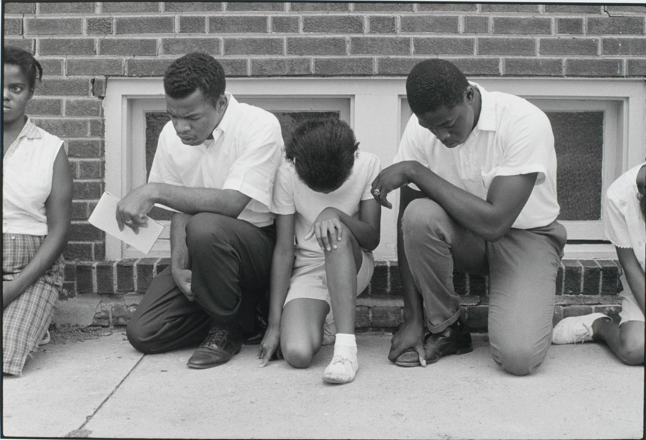 SNCC Field Secretary (Later SNCC Chairman, Now Congressman) John Lewis and Others Pray during a Demonstration