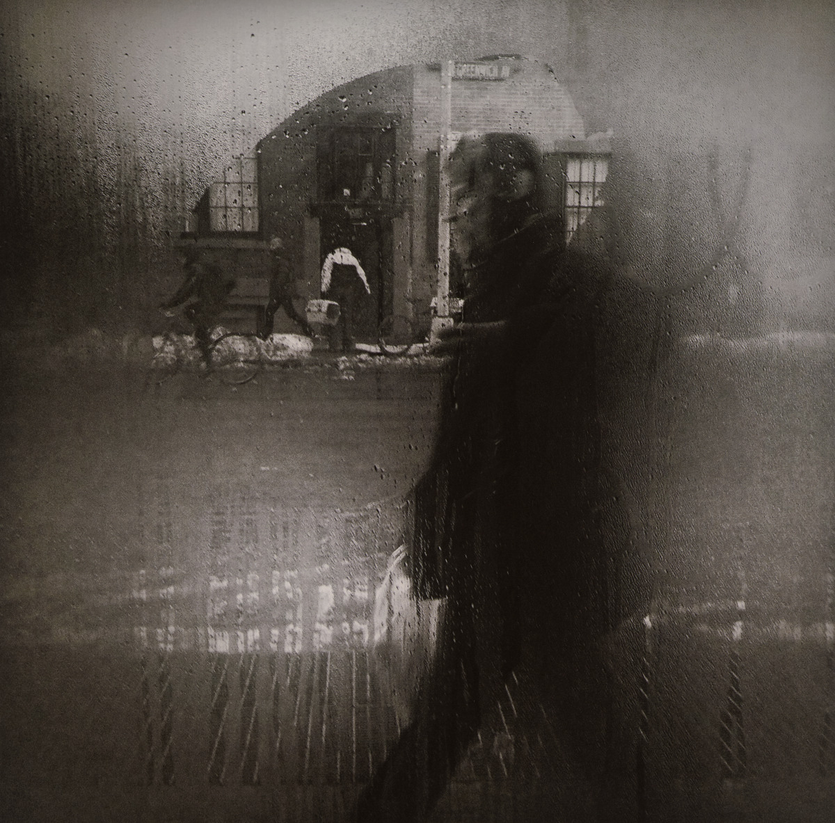 The Man behind the Foggy Glass