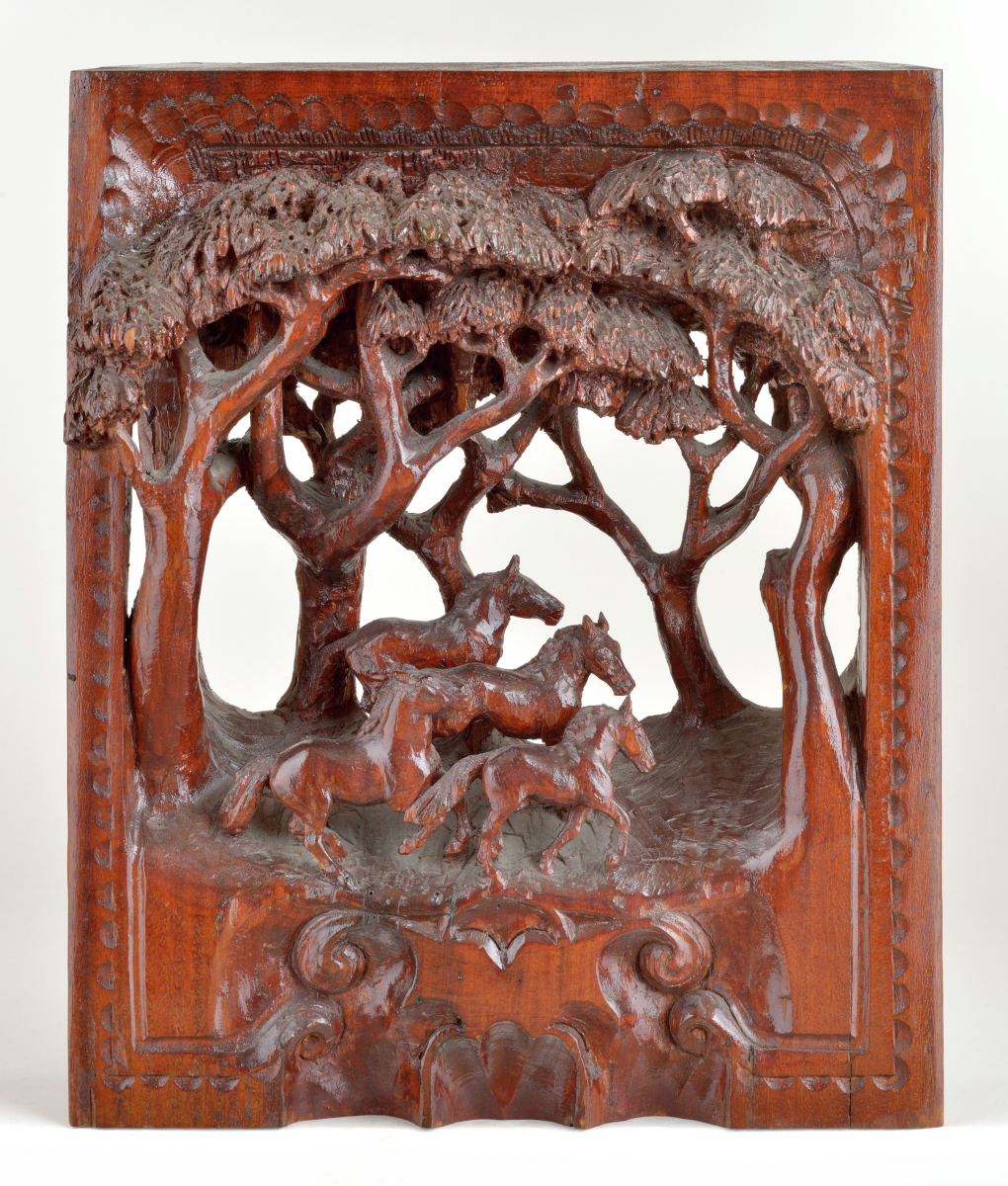 American carved wooden figural group depicting four horses running in woods amidst group of trees having square carved frame