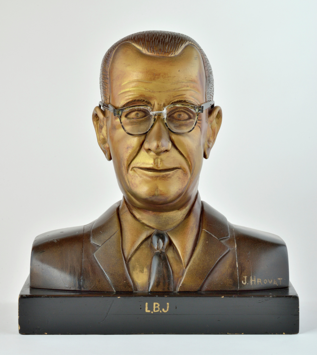 American polychrome carved wooden head and shoulder bust portrait depicting Lyndon B. Johnson with LBJ in gold on base