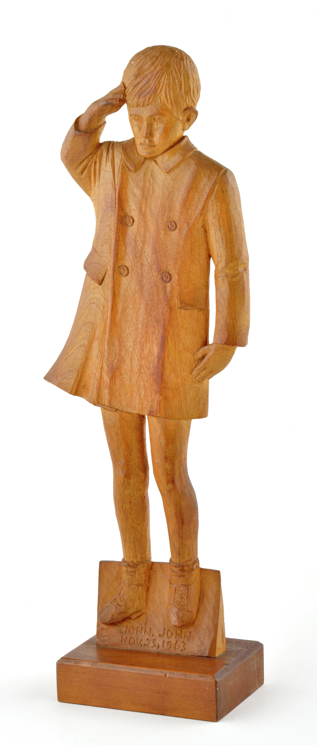 American carved wppden sculpture depicting standing JFK Jr. saluting at his father’s funeral, Nov. 23 1963, on the back carved bt H.E. Berretta for Dr. S.S. Sverdlik