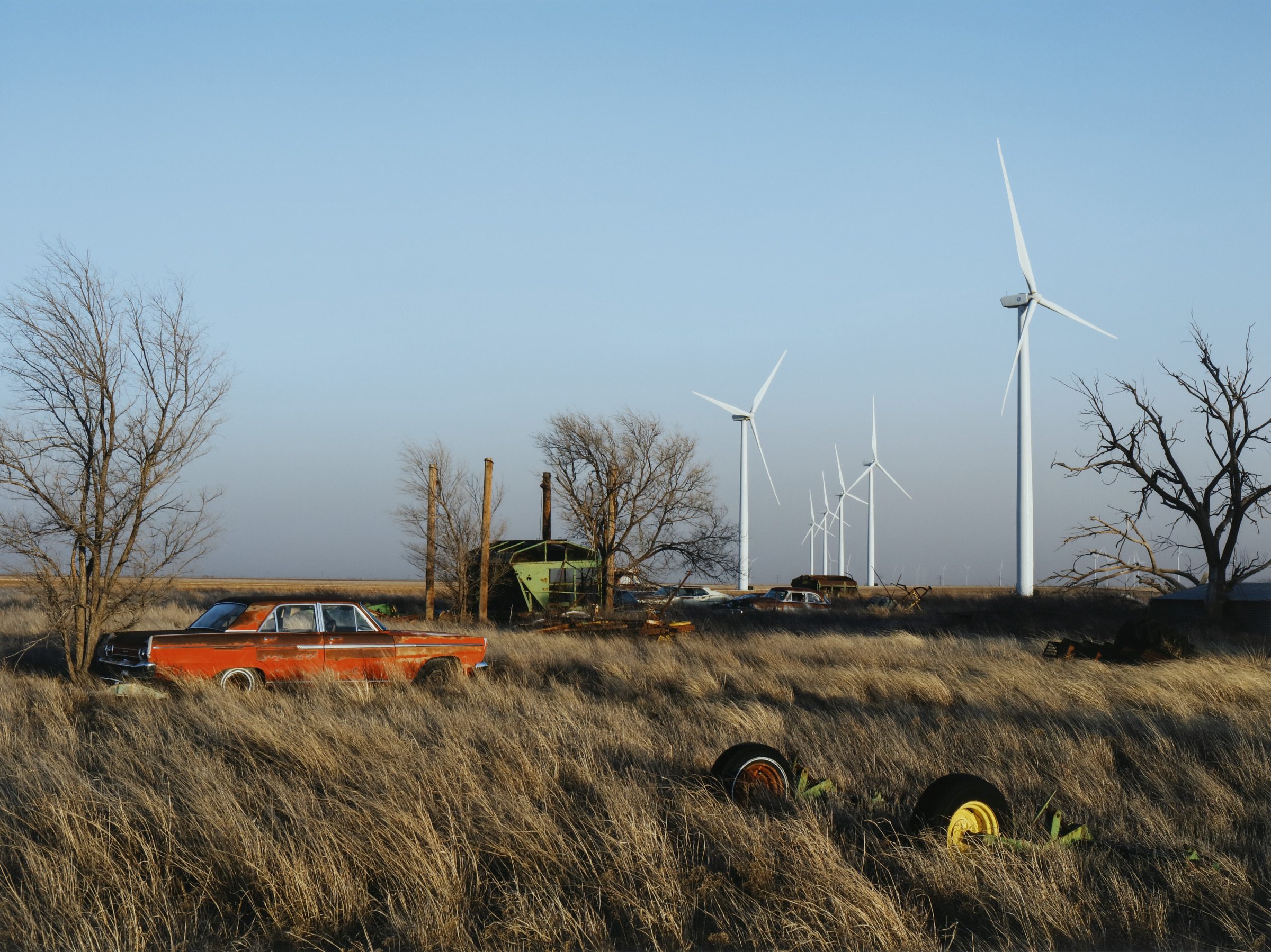 New Wind Turbines next to an Abandoned Farm, Texas