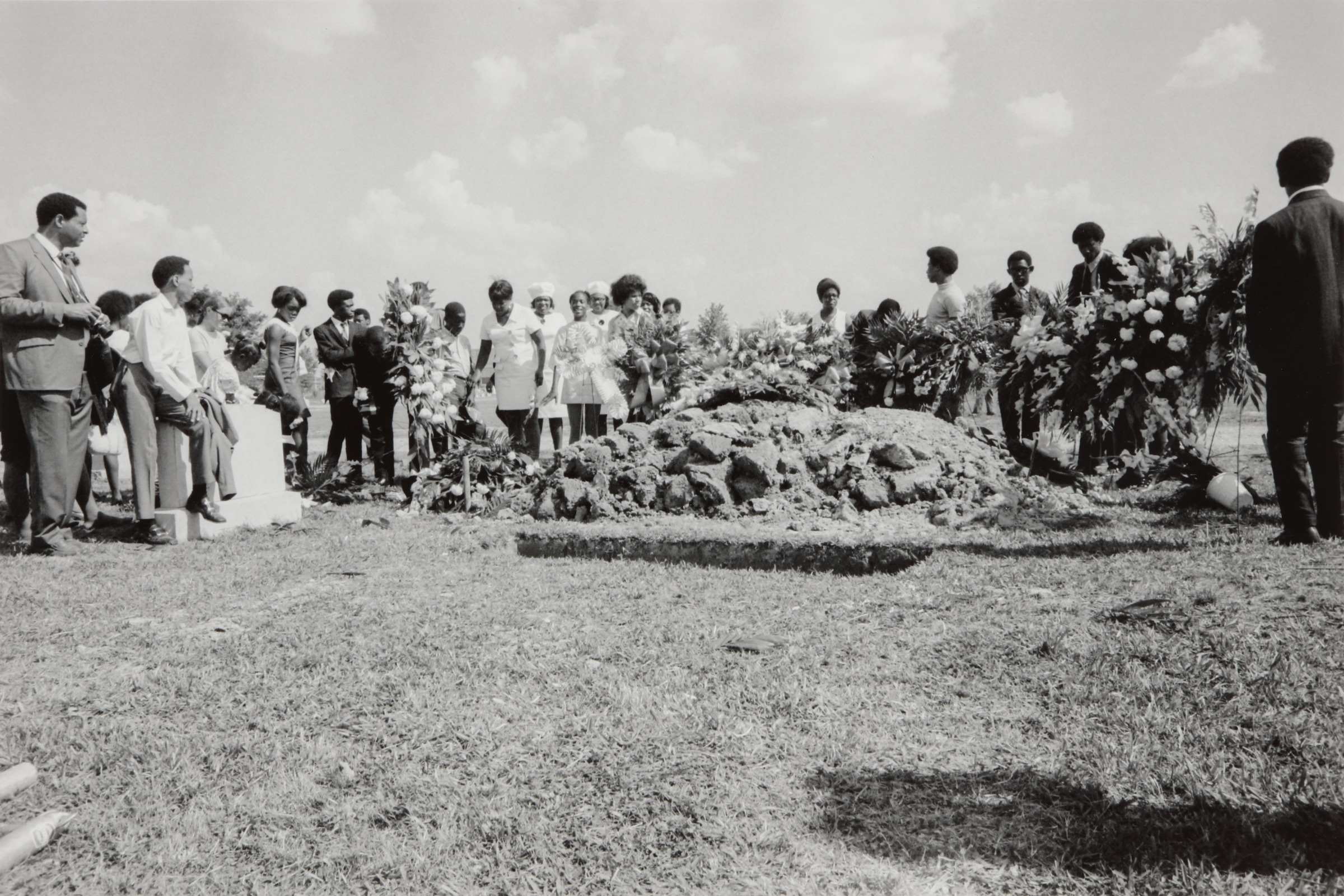 Family and friends of the deceased high school student James Earl Green, gather at his burial site, Jackson, Mississippi, May