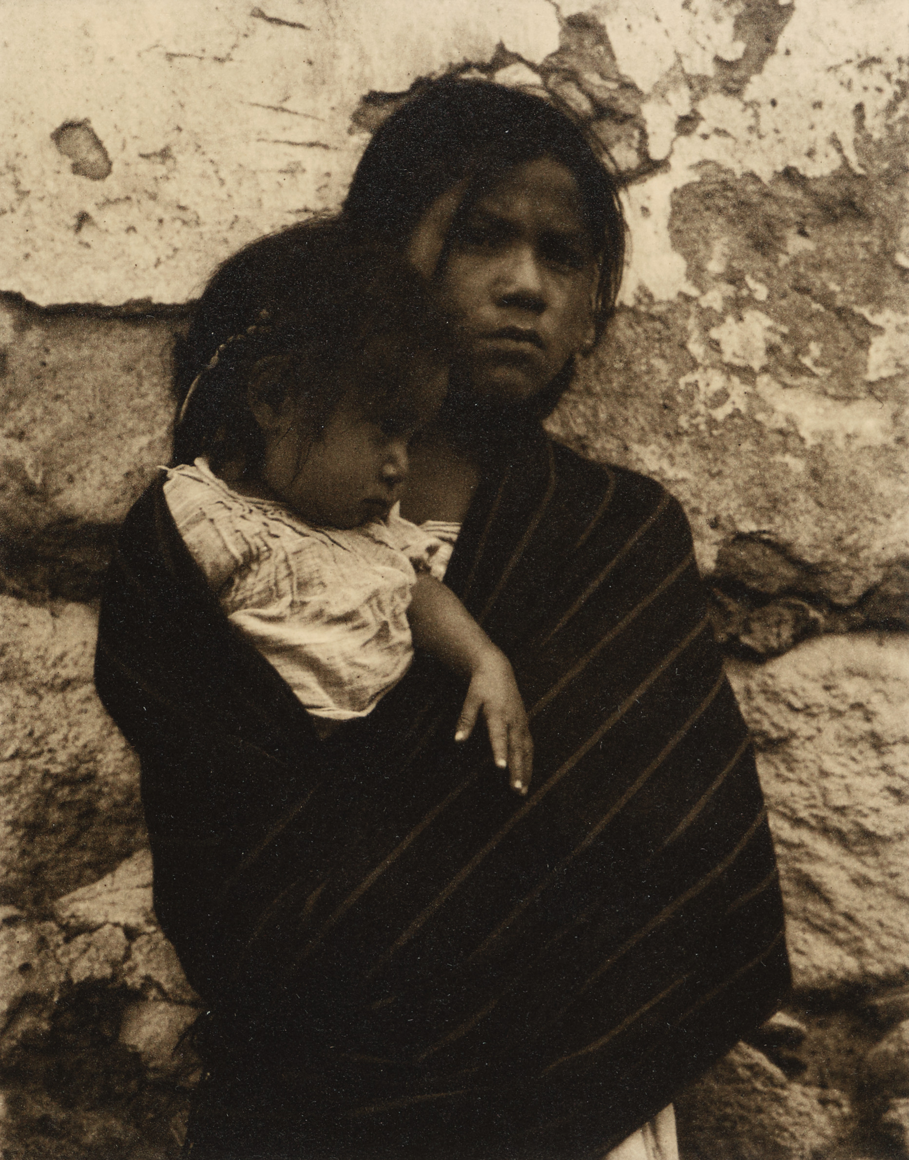 Young Girl Holding Child